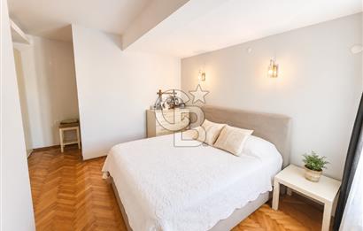 OLİMPİYAT KÖYÜNDE GENİŞ TERASLI MODERN 3+1 KISMİ EŞYALI SATILIK