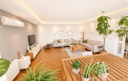 OLİMPİYAT KÖYÜNDE GENİŞ TERASLI MODERN 3+1 KISMİ EŞYALI SATILIK