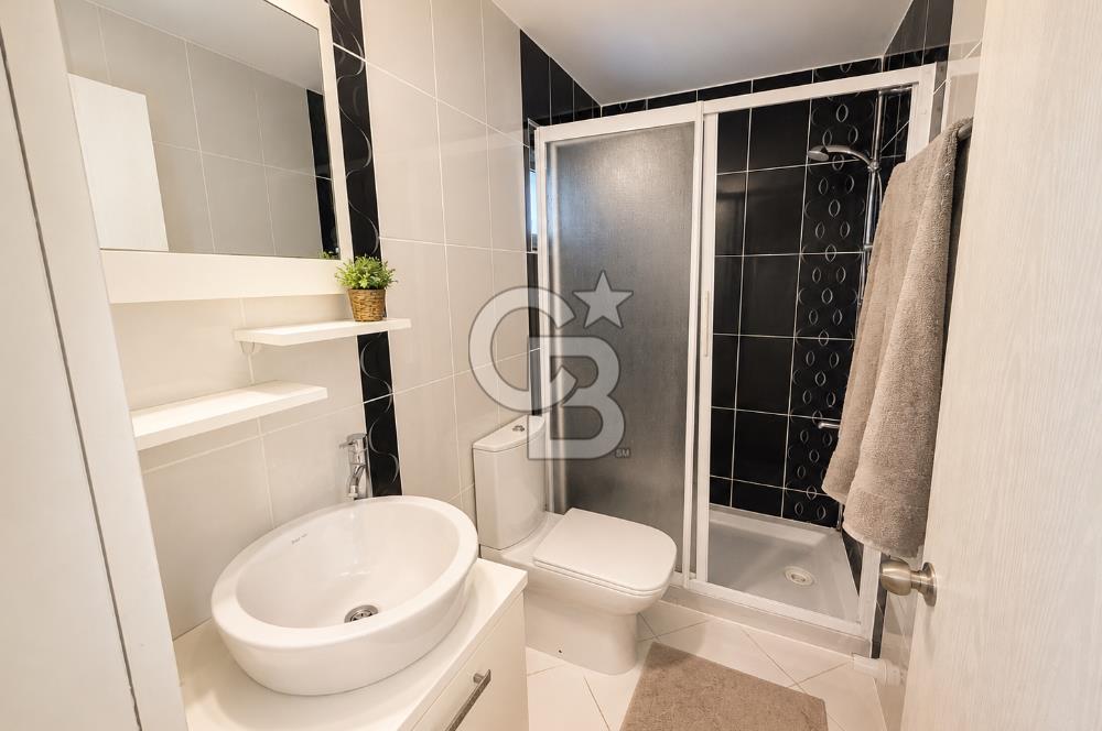 OLİMPİYAT KÖYÜNDE GENİŞ TERASLI MODERN 3+1 KISMİ EŞYALI SATILIK