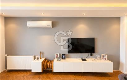 OLİMPİYAT KÖYÜNDE GENİŞ TERASLI MODERN 3+1 KISMİ EŞYALI SATILIK