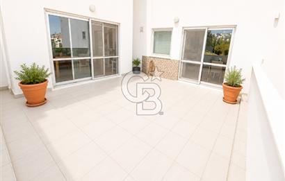 OLİMPİYAT KÖYÜNDE GENİŞ TERASLI MODERN 3+1 KISMİ EŞYALI SATILIK