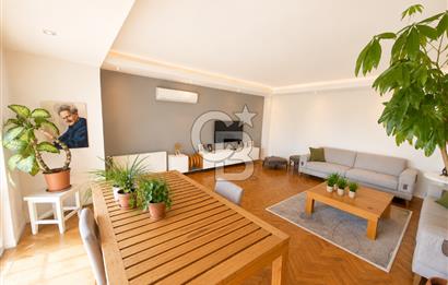 OLİMPİYAT KÖYÜNDE GENİŞ TERASLI MODERN 3+1 KISMİ EŞYALI SATILIK