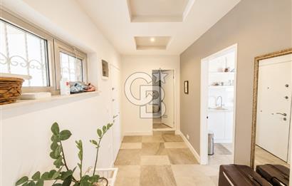 OLİMPİYAT KÖYÜNDE GENİŞ TERASLI MODERN 3+1 KISMİ EŞYALI SATILIK