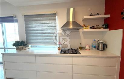 OLİMPİYAT KÖYÜNDE GENİŞ TERASLI MODERN 3+1 KISMİ EŞYALI SATILIK