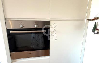 OLİMPİYAT KÖYÜNDE GENİŞ TERASLI MODERN 3+1 KISMİ EŞYALI SATILIK