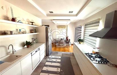 OLİMPİYAT KÖYÜNDE GENİŞ TERASLI MODERN 3+1 KISMİ EŞYALI SATILIK