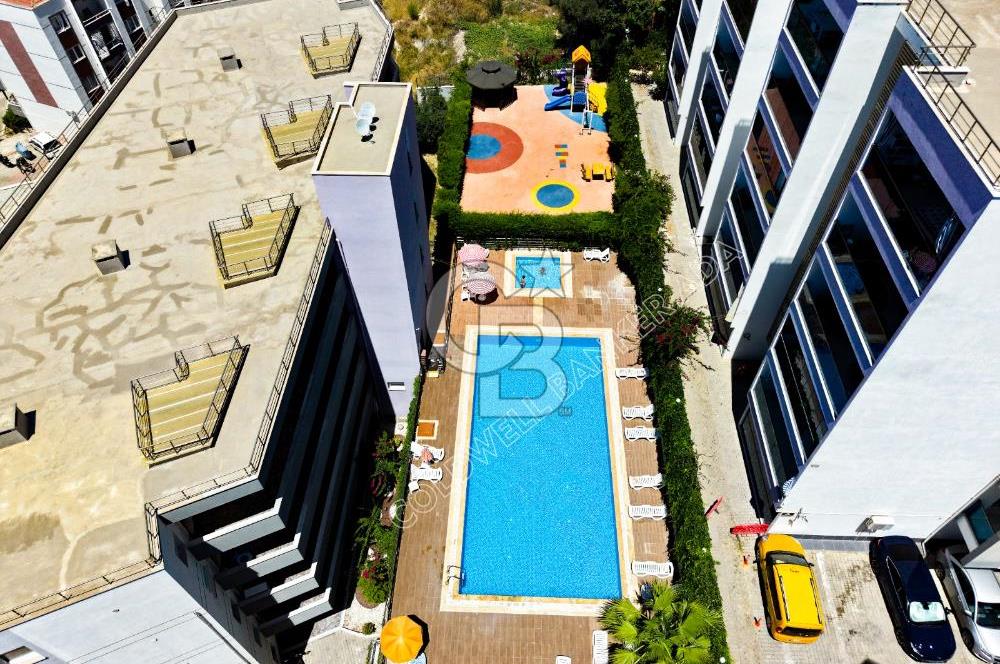 Emsallerinin Altında Kuşadası Lila Evler'de Satılık 2+1 Daire