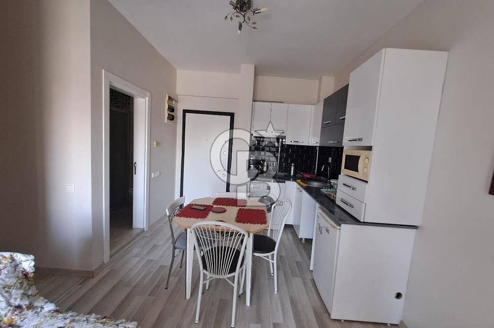 Seyrek'te Havuzlu ve Yeşillikli Site Eşyalı Kiralık 1+1