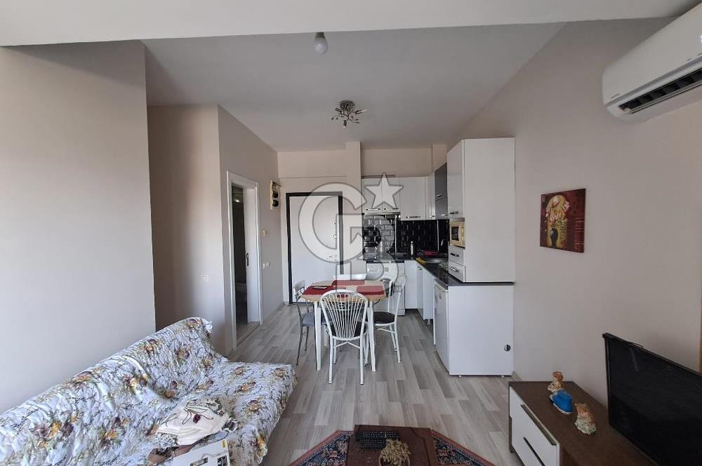 Seyrek'te Havuzlu ve Yeşillikli Site Eşyalı Kiralık 1+1