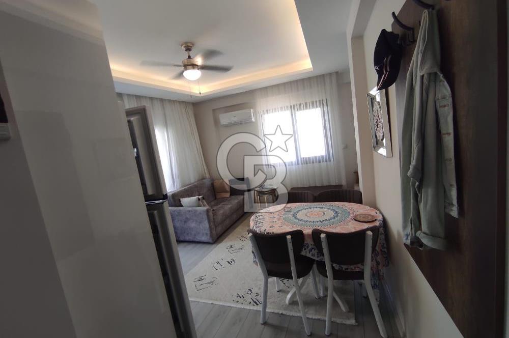 DİKİLİ ÇANDARLI MERKEZDE 1+1 EŞYALI BAHÇELİ SATILIK DAİRE