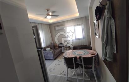 DİKİLİ ÇANDARLI MERKEZDE 1+1 EŞYALI BAHÇELİ SATILIK DAİRE