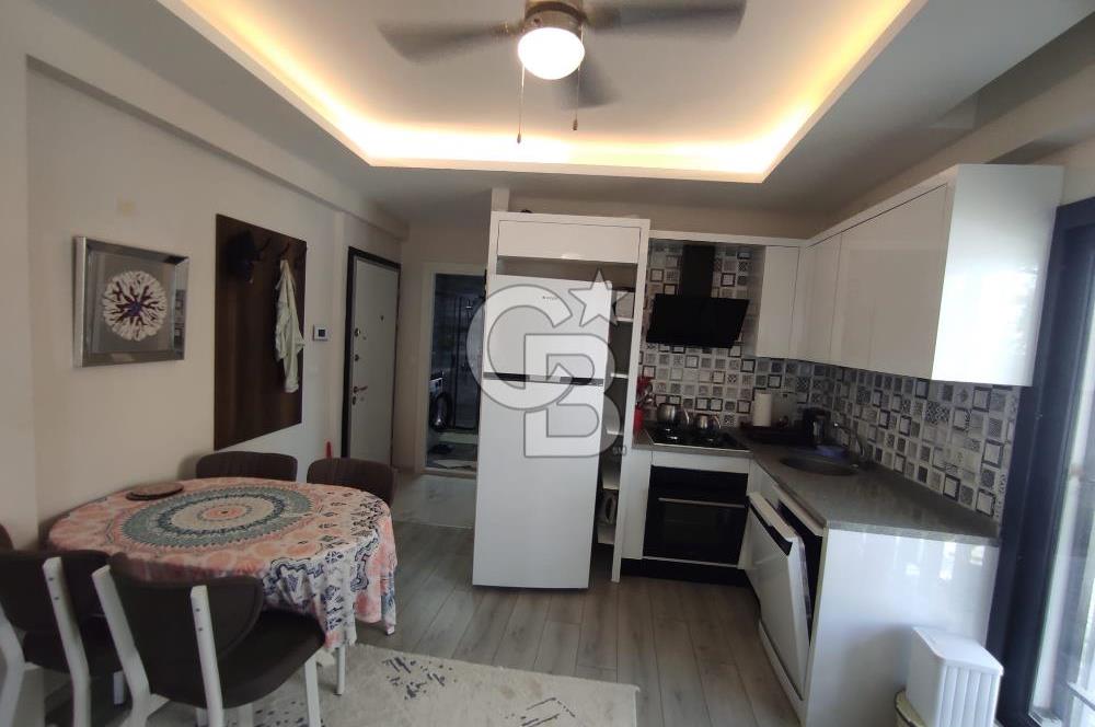 DİKİLİ ÇANDARLI MERKEZDE 1+1 EŞYALI BAHÇELİ SATILIK DAİRE