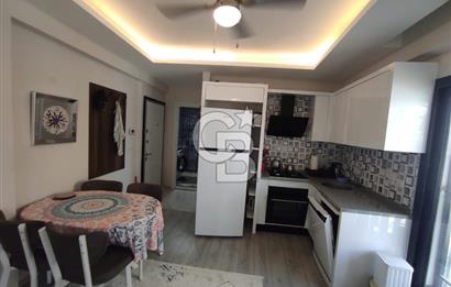 DİKİLİ ÇANDARLI MERKEZDE 1+1 EŞYALI BAHÇELİ SATILIK DAİRE