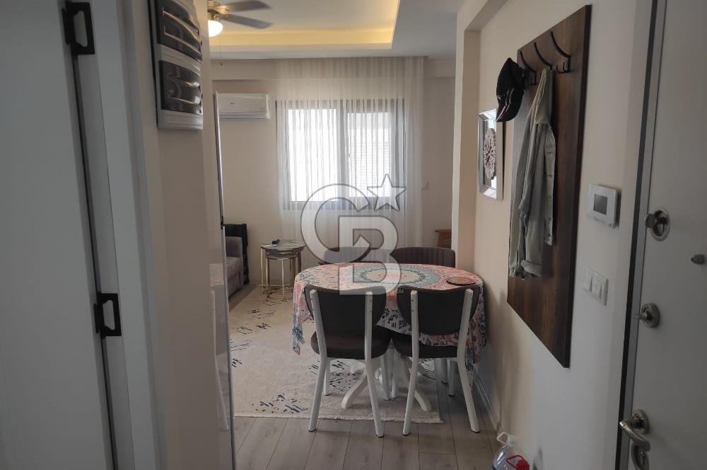 DİKİLİ ÇANDARLI MERKEZDE 1+1 EŞYALI BAHÇELİ SATILIK DAİRE