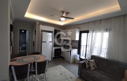 DİKİLİ ÇANDARLI MERKEZDE 1+1 EŞYALI BAHÇELİ SATILIK DAİRE