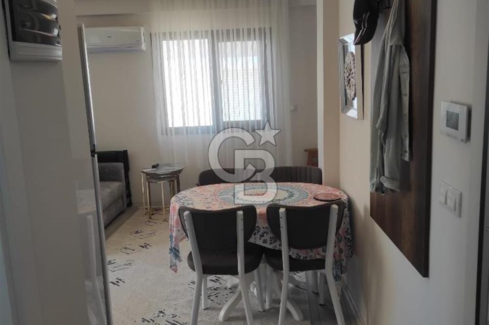 DİKİLİ ÇANDARLI MERKEZDE 1+1 EŞYALI BAHÇELİ SATILIK DAİRE