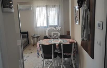 DİKİLİ ÇANDARLI MERKEZDE 1+1 EŞYALI BAHÇELİ SATILIK DAİRE