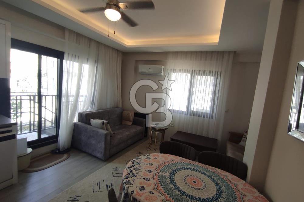 DİKİLİ ÇANDARLI MERKEZDE 1+1 EŞYALI BAHÇELİ SATILIK DAİRE