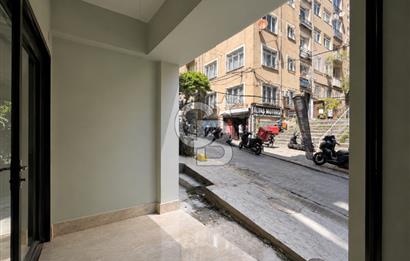 Kazancı'da Yeni Binada Yüksek Tavanlı İki Katlı Kiralık Dükkan