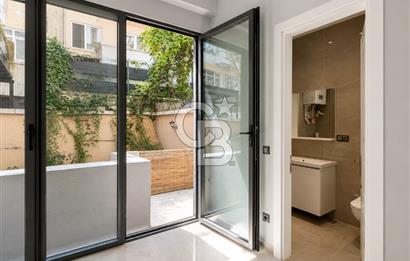 Kazancı'da Yeni Binada Yüksek Tavanlı İki Katlı Kiralık Dükkan