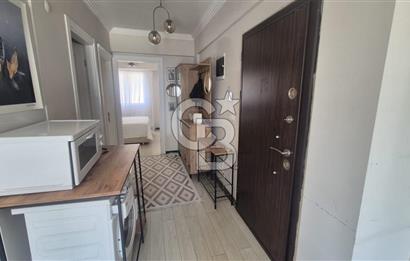 BUCA KURUÇEŞME DOĞUŞ CADDESİNDE EŞYALI BALKONLU ARAKAT SATILIK 2+1 DAİRE