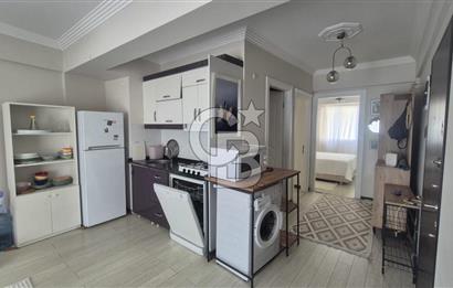 BUCA KURUÇEŞME DOĞUŞ CADDESİNDE EŞYALI BALKONLU ARAKAT SATILIK 2+1 DAİRE