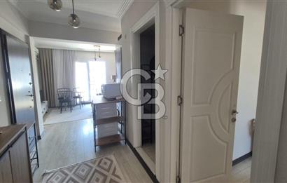 BUCA KURUÇEŞME DOĞUŞ CADDESİNDE EŞYALI BALKONLU ARAKAT SATILIK 2+1 DAİRE