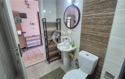 BUCA KURUÇEŞME DOĞUŞ CADDESİNDE EŞYALI BALKONLU ARAKAT SATILIK 2+1 DAİRE