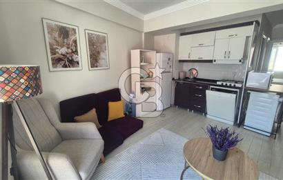 BUCA KURUÇEŞME DOĞUŞ CADDESİNDE EŞYALI BALKONLU ARAKAT SATILIK 2+1 DAİRE