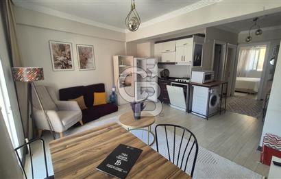 BUCA KURUÇEŞME DOĞUŞ CADDESİNDE EŞYALI BALKONLU ARAKAT SATILIK 2+1 DAİRE