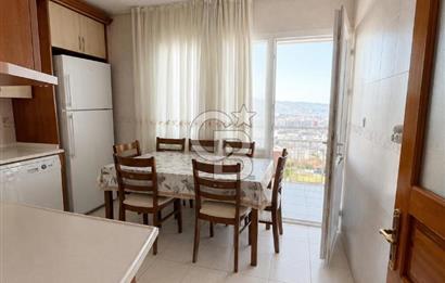 Bornova'da deniz ve şehir manzaralı merkezi konumda 3+1 satılık daire