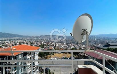Bornova'da deniz ve şehir manzaralı merkezi konumda 3+1 satılık daire
