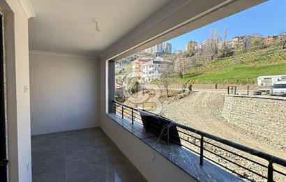 BAHÇEÇİK'DE ÖN CEPHE SIFIR 1+1 SATILIK DAİRE
