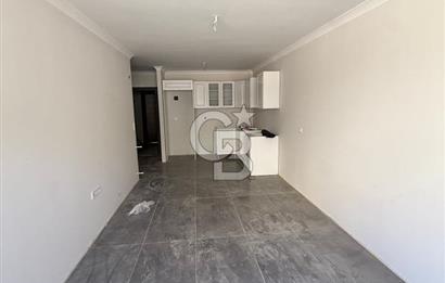BAHÇEÇİK'DE ÖN CEPHE SIFIR 1+1 SATILIK DAİRE
