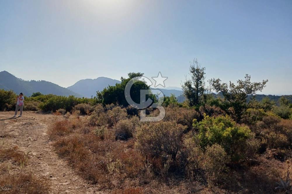 MARMARİS ORHANİYE KIZKUMUNDA PANORAMİK DENİZ MANZARALI ARSA