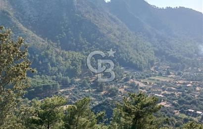 MARMARİS ORHANİYE KIZKUMUNDA PANORAMİK DENİZ MANZARALI ARSA