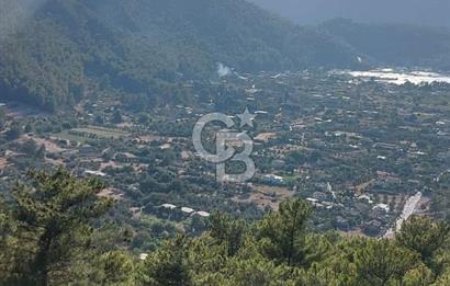MARMARİS ORHANİYE KIZKUMUNDA PANORAMİK DENİZ MANZARALI ARSA