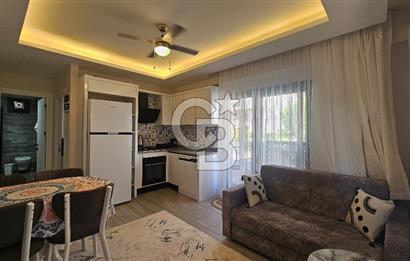 DİKİLİ ÇANDARLI MERKEZDE 1+1 EŞYALI BAHÇELİ SATILIK DAİRE