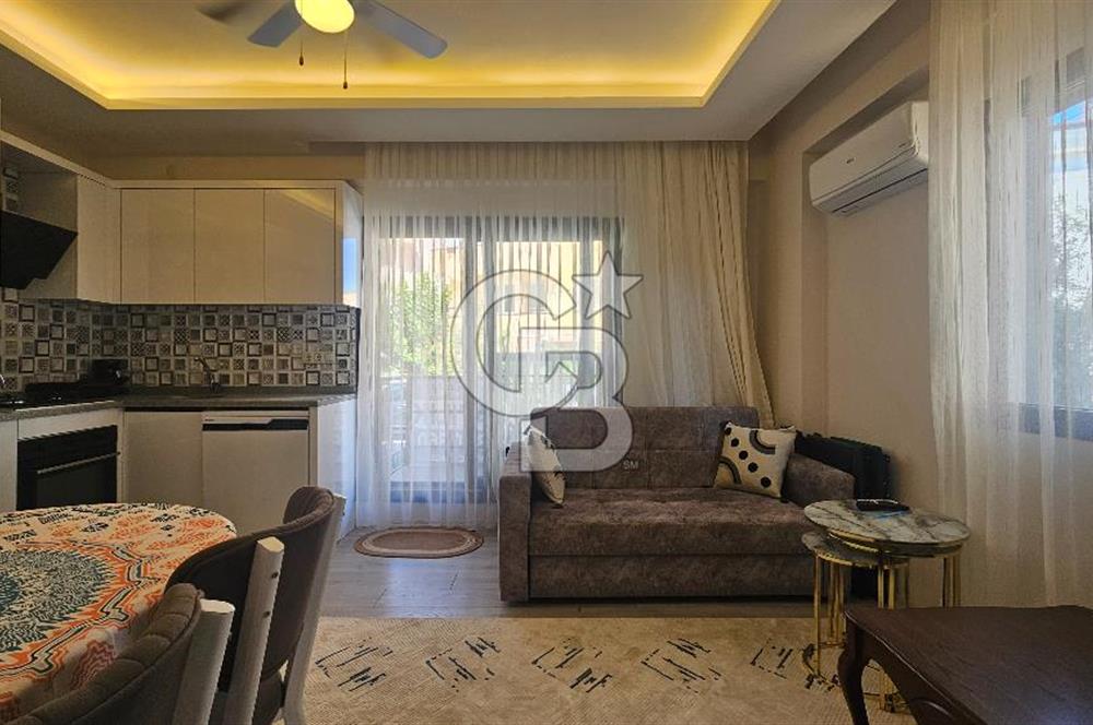 DİKİLİ ÇANDARLI MERKEZDE 1+1 EŞYALI BAHÇELİ SATILIK DAİRE
