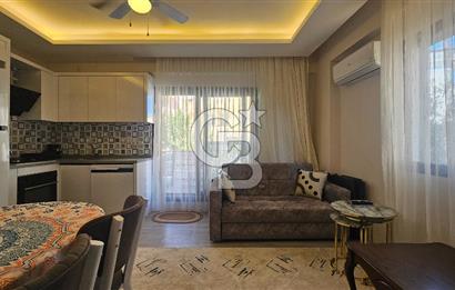 DİKİLİ ÇANDARLI MERKEZDE 1+1 EŞYALI BAHÇELİ SATILIK DAİRE