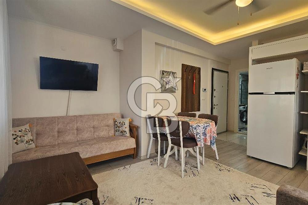 DİKİLİ ÇANDARLI MERKEZDE 1+1 EŞYALI BAHÇELİ SATILIK DAİRE