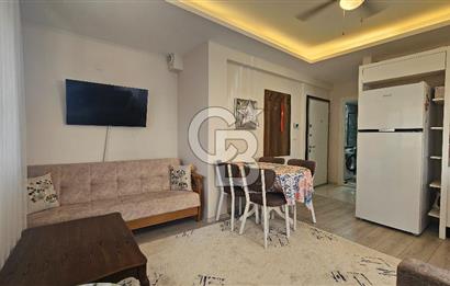 DİKİLİ ÇANDARLI MERKEZDE 1+1 EŞYALI BAHÇELİ SATILIK DAİRE