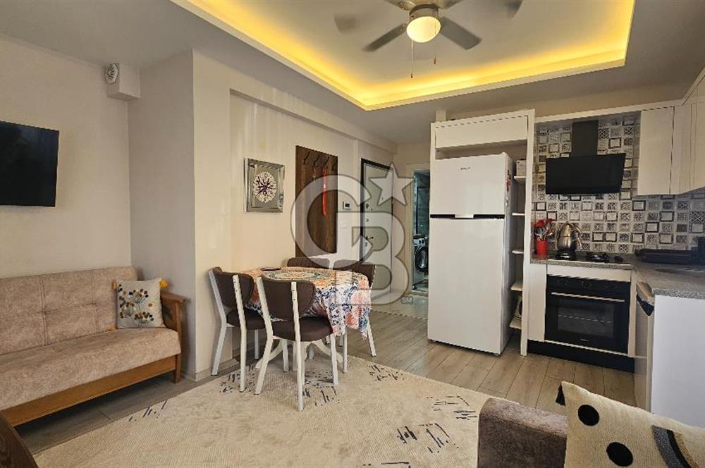 DİKİLİ ÇANDARLI MERKEZDE 1+1 EŞYALI BAHÇELİ SATILIK DAİRE