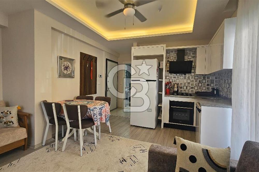 DİKİLİ ÇANDARLI MERKEZDE 1+1 EŞYALI BAHÇELİ SATILIK DAİRE