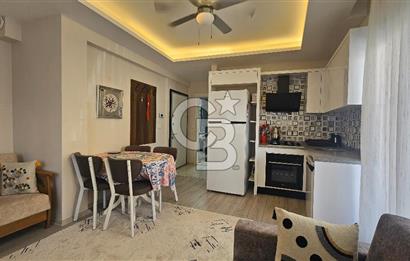DİKİLİ ÇANDARLI MERKEZDE 1+1 EŞYALI BAHÇELİ SATILIK DAİRE