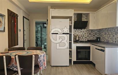 DİKİLİ ÇANDARLI MERKEZDE 1+1 EŞYALI BAHÇELİ SATILIK DAİRE