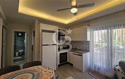 DİKİLİ ÇANDARLI MERKEZDE 1+1 EŞYALI BAHÇELİ SATILIK DAİRE