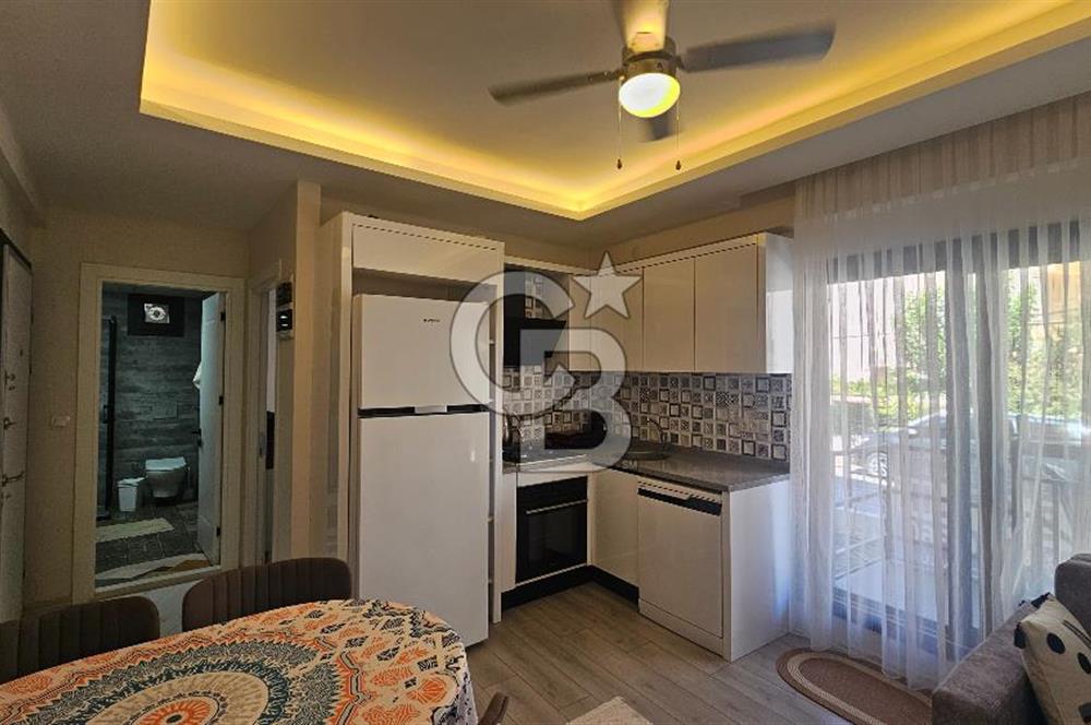 DİKİLİ ÇANDARLI MERKEZDE 1+1 EŞYALI BAHÇELİ SATILIK DAİRE