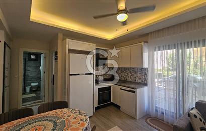 DİKİLİ ÇANDARLI MERKEZDE 1+1 EŞYALI BAHÇELİ SATILIK DAİRE