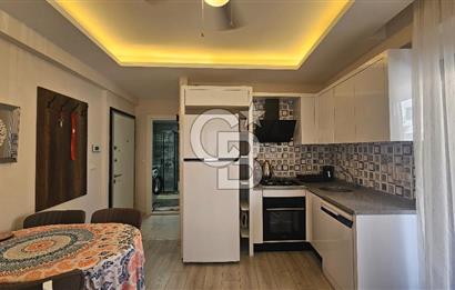 DİKİLİ ÇANDARLI MERKEZDE 1+1 EŞYALI BAHÇELİ SATILIK DAİRE